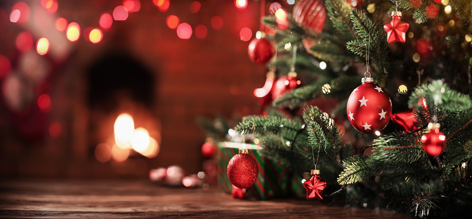 image of a Christmas tree in front of a fire place.