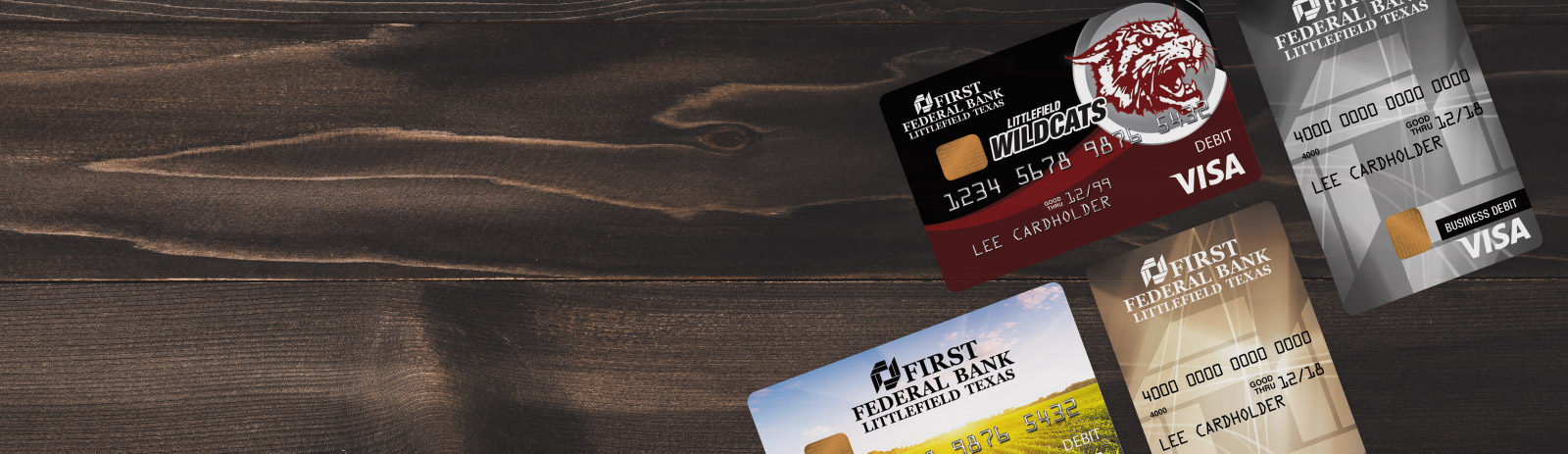 Four FFBLT debit cards on a wooden table